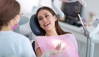 Patient and orthodontic team member having conversation