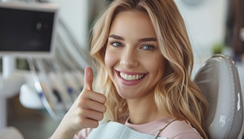 Happy patient making thumbs-up gesture