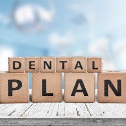 “Dental Plan” written on wooden blocks, sitting on tabletop