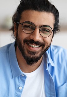 Man smiling with self ligating braces near Lewis Center