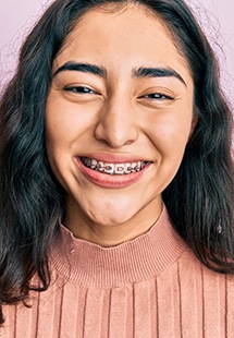 Woman smiling with traditional braces near Lewis Center