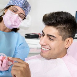 Patient and orthodontic team member engaged in conversation