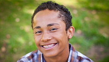 young man with braces smiling