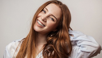 young woman with traditional braces