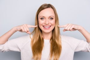 Patient with straight teeth after Invisalign or hidden braces