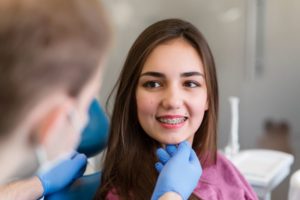 : Smiling orthodontic patient with braces