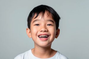 Portrait of happy young boy with braces