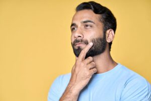 Man wearing thoughtful, curious expression